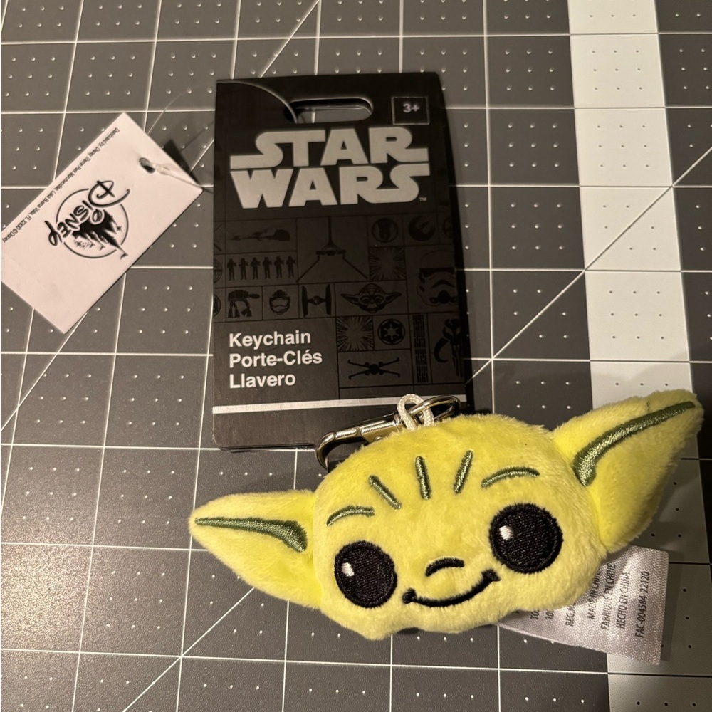 Star Wars Yellow and Black Baby Yoda Keychain. Soft plushy